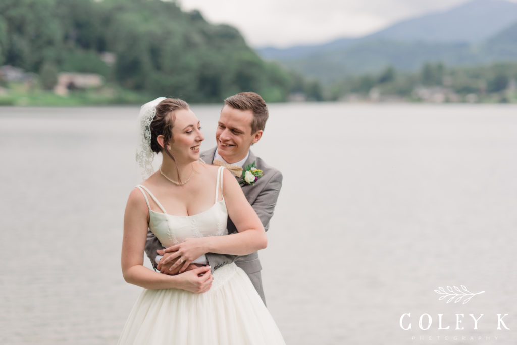 Bride and Groom Portraits by Lake Junaluska with Mountains in background