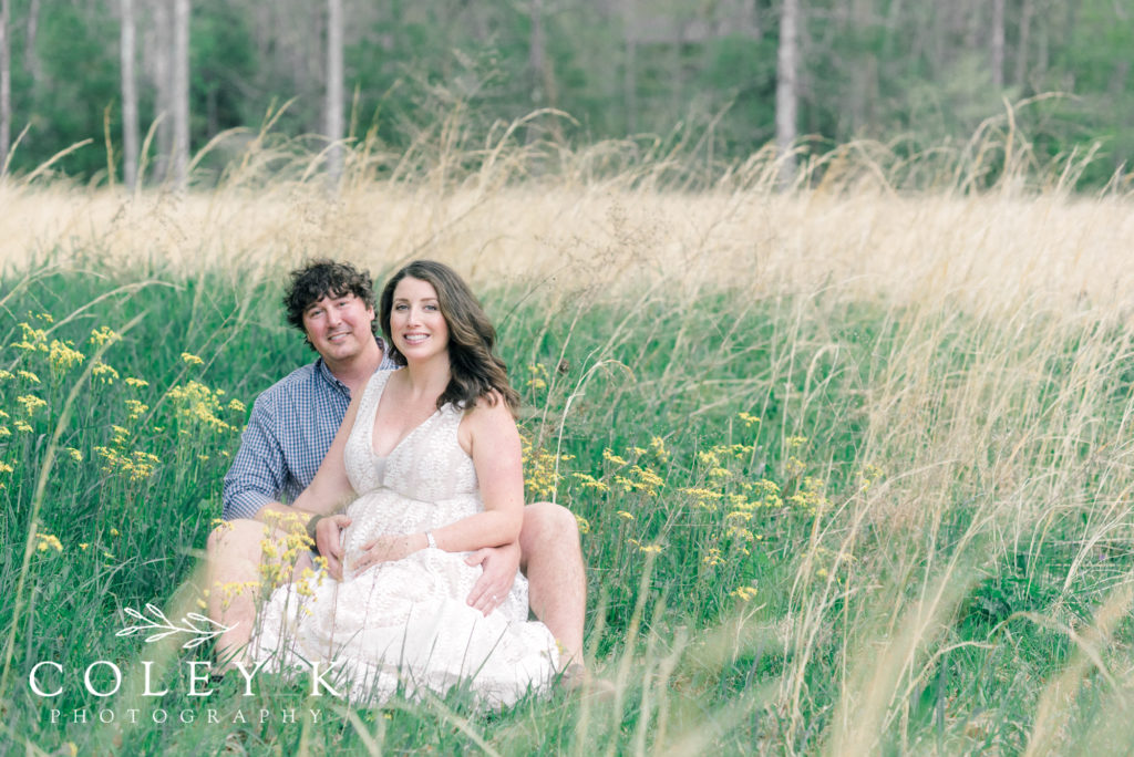 Asheville Motherhood Photographer couple maternity in field of flower
