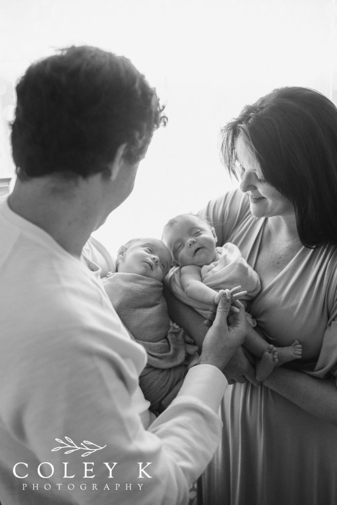 newborn twins black and white photo