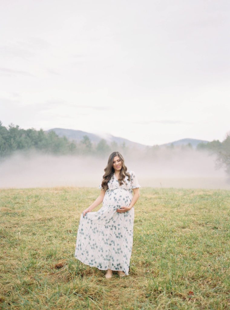 Luxury Maternity photo beautiful dress and setting shows example of how much maternity photos should cost
